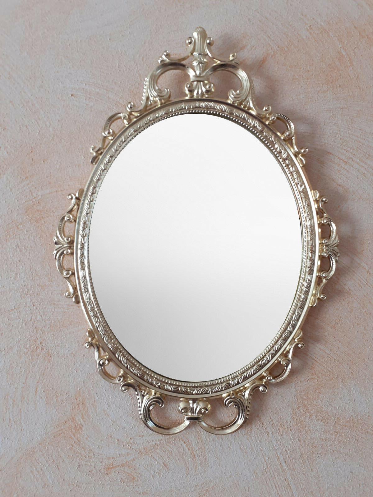 cornice con specchio in metallo made in